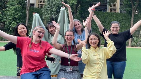 seven female staff members having fun outside chengdu international school