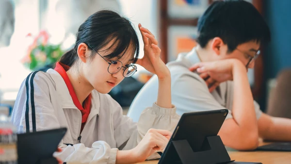 students studying on computers at chengdu international school secondary