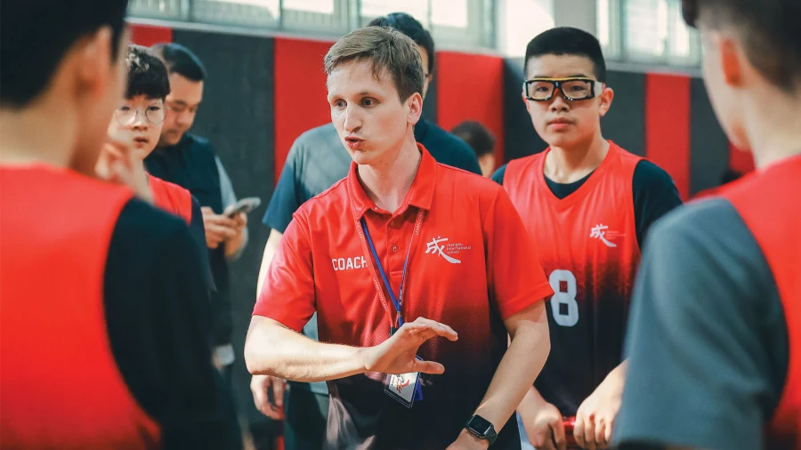 chengdu international school teachers and coaches teaching sports to our students