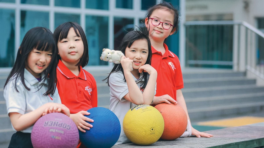 chengdu international school address where these four female students enjoy kickball outside